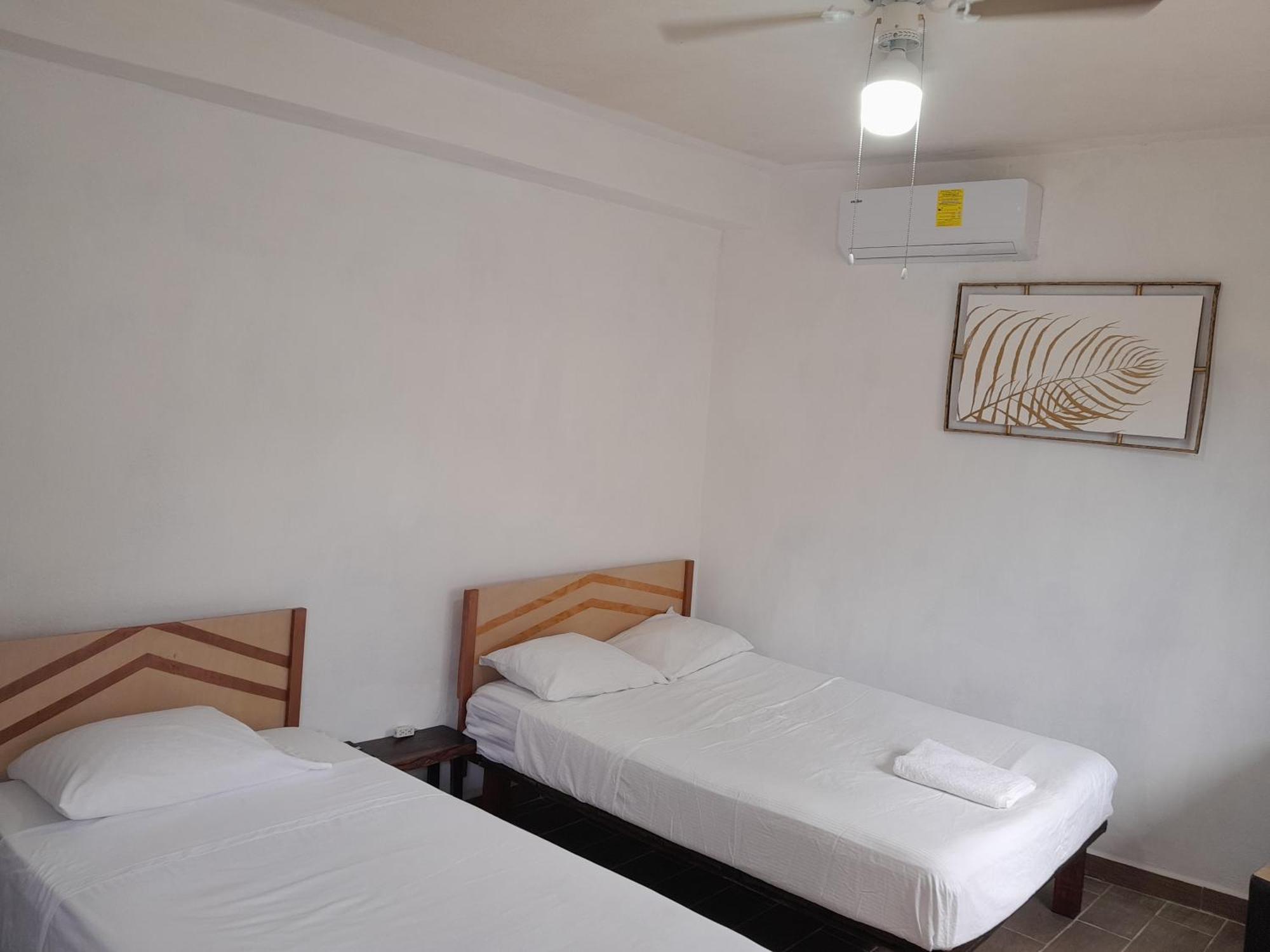Quarto Triplo com Casa de Banho Privativa